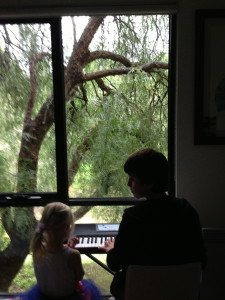 Billy playing piano with Cosy